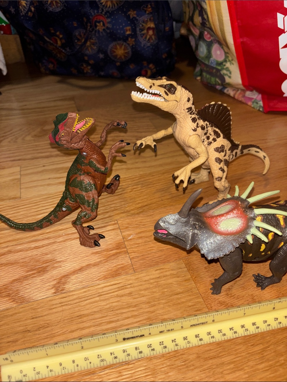 3 toy dinosaurs -one lights up and growls/hisses all good condition